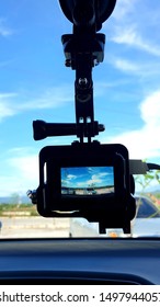 Looking Over A Go Pro Hanging Inside Of A Car