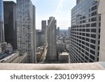 Looking over a ledge at the Chicago skyline in summer day