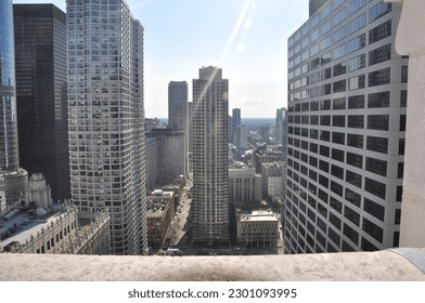 Looking over a ledge at the Chicago skyline in summer day
