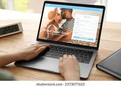 Looking for partner. Woman creating account on dating site via laptop, closeup - Shutterstock ID 2373077623