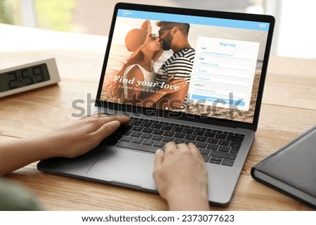 Looking for partner. Woman creating account on dating site via laptop, closeup