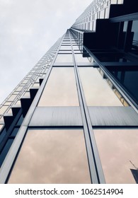 Looking up at a scyscraper.