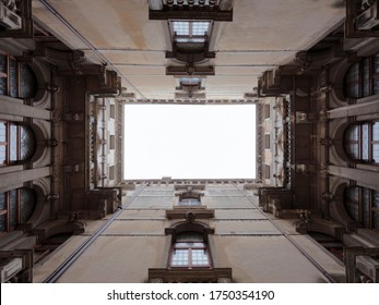 Looking Up At The Sky In A Courtyard Of The Palazzo Ca Rezzonico, Venice, Italy