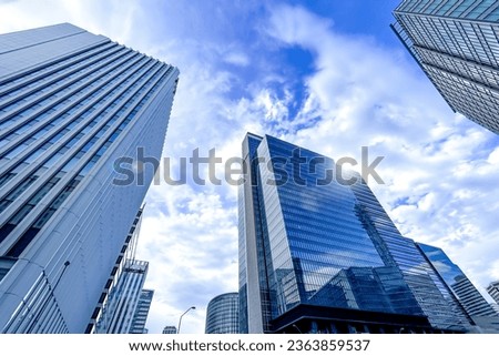 Looking up at the sky and stylish city buildings