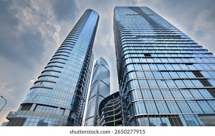 Looking up at a skyscraper in Chengdu High tech Zone under the clouds