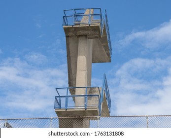 Looking Up At Stairs And High Dive Board At A World Class Training Swimming Pool