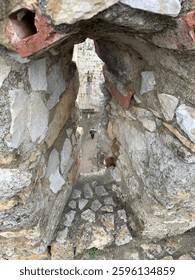Looking through an arrowslit at Castelo de São Jorge, Lisbon
