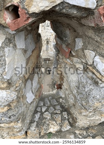 Looking through an arrowslit at Castelo de São Jorge, Lisbon