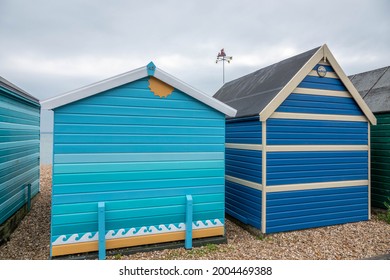 Looking Through The Beach Huts Towards The Sea On A Stormy Summer Day