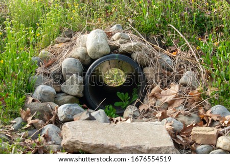 Similar – Image, Stock Photo Look through stone pipes with resistant glaze placed on the ground in front construction site