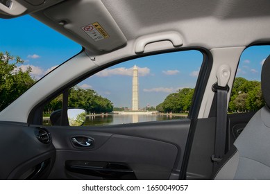 Looking through a car window with view of the Washington Monument and Reflecting Pool, Washington DC, USA