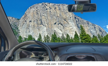 Looking through a car windshield with view of El Capitan, iconic mountain in Yosemite National Park, California, USA