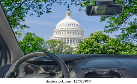 Looking through a car windshield with view of United States Capitol building, iconic home of the United States Congress, Washington DC, USA
