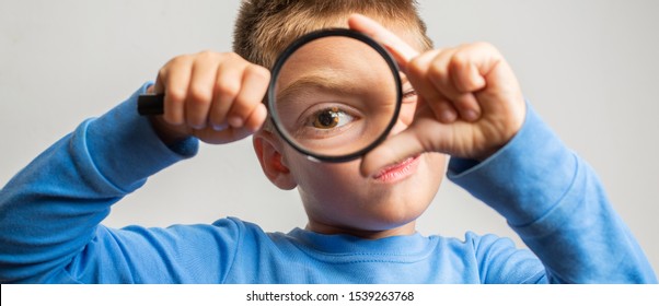 looking through a magnifying glass, large eyes