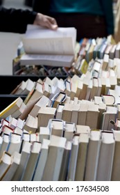 Looking through old books in a second hand sale