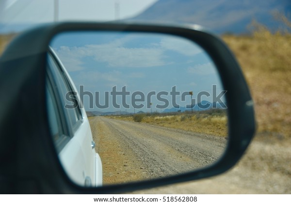 Looking through\
the side view mirror in\
Namibia
