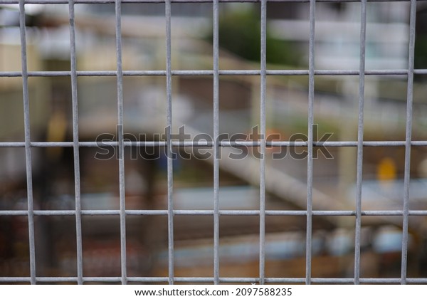 looking through a steel fence
background blurred and fence in full focus Sydney NSW
Australia