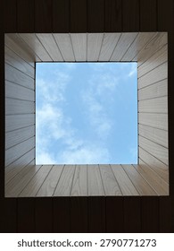 Looking up through timber lined skylight
