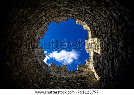 Looking up through the top of a castle