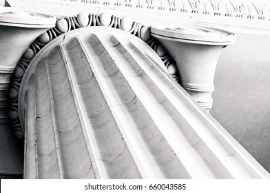 Looking up at the top of a column with lines running diagonally through the frame