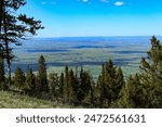 Looking toward Sheridan, WY and beyond from Bosin Rock in the Bighorn Mountains SW of Big Horn, WY 