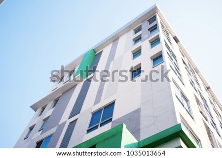 Looking up. View of dormitories with background sky background. 
