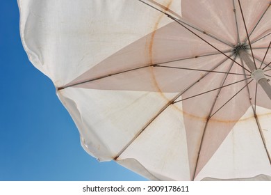 Looking Upward At Sky With Beach Umbrellas Overhead.