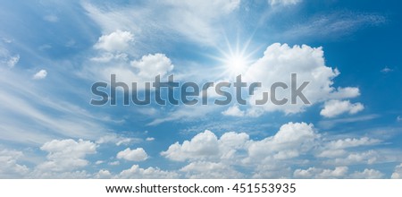  Looking up view of panorama blue sky with clouds and sun reflection
