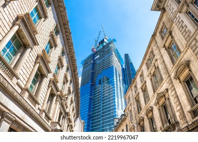 Looking up view at Threadneedle street road with old architecture, modern skyscraper office building in construction in City of London, United Kingdom - Powered by Shutterstock