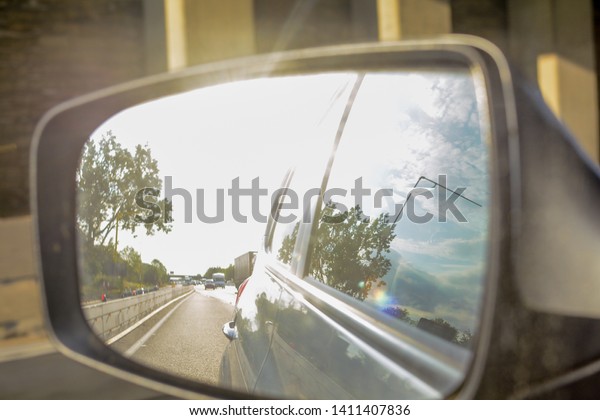 Looking in the
wing mirror whilst driving in a
car