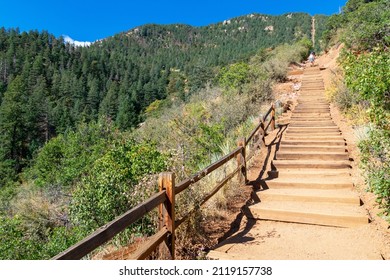 Looking up at wooden steps leading up to the top of Manitou Incline. Manitou Springs Incline is a popular hiking trail rising above Manitou Springs, Colorado - Shutterstock ID 2119157738