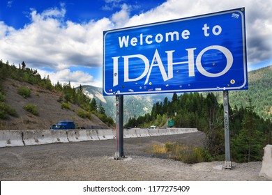 LOOKOUT PASS, IDAHO, USA - September 1, 2018: Traffic drives past the Welcome to Idaho sign on Interstate 90 at the Idaho - Montana border