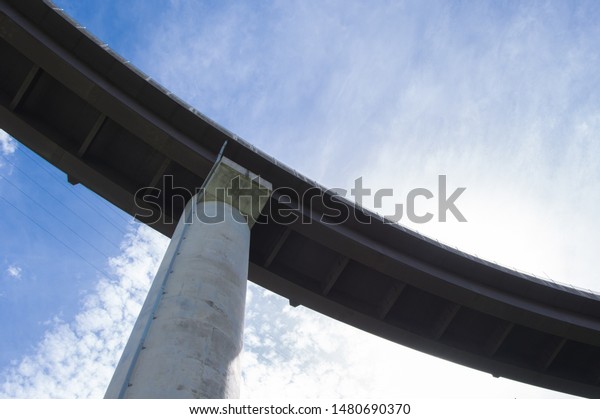 Loop bridge towering over\
the sky.