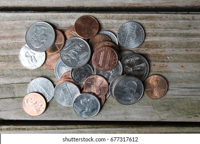 Loose Change On Wood Table