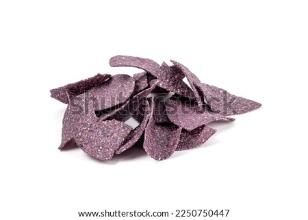 Loose crunchy blue corn tortilla chips isolated on white