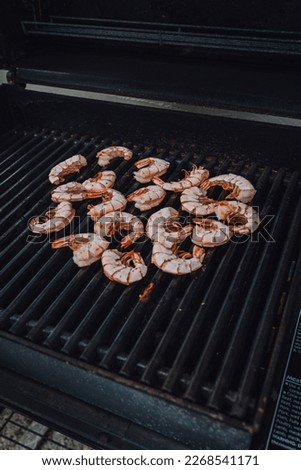loose prawns with shell on the barbecue grill, shrimp on the barbie