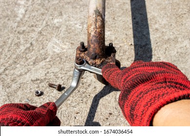 Loosen The Rusty Nut By Using The Handle, Wrench And Bracket To Remove The Nut From The Bolt.