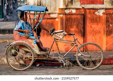 Lopburi, Thailand - 01 16 2020: Cycle Rickshaw driver near San Phrakan