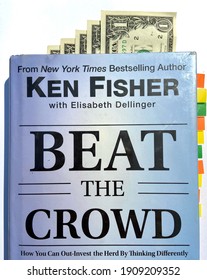 Lopburi, Thailand - Feb 4 2021: Editorial Use Only, Beat The Crowd Book By Ken Fisher With Steps Of One Dollar Bank Notes And Colorful Bookmarks.