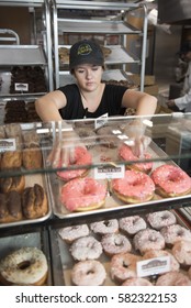 Lora Denkova Sorts Donuts In The Display Case At Donut Bar In Las Vegas, Nev., Saturday, Jan. 14, 2017.