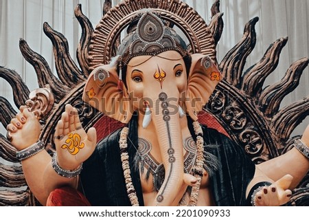 Lord Ganesh in Dark Dress Colors. Beautiful Statue. Main Hindu God Statue. Wallpaper