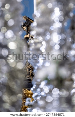 The Lord of Gran Poder, glimpsed through the silver canopy poles of the Brotherhood's palio float,