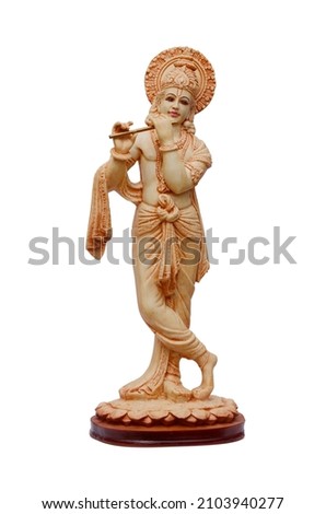 Lord Krishna plastic statue isolated on white background. 