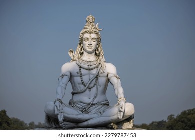 Lord Shiva, Handmade statue of lord shiv with plain background near river ganges ghat in rishikesh. Selective focus.
