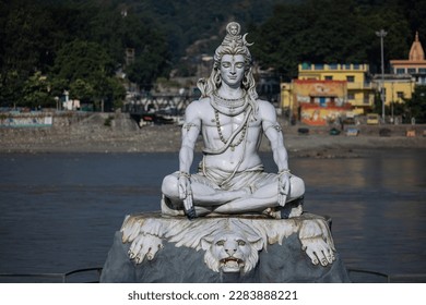 Lord Shiva, Handmade statue of lord shiv with plain background near river ganges ghat in rishikesh.