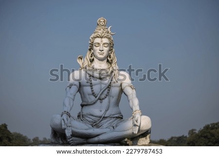 Lord Shiva, Handmade statue of lord shiv with plain background near river ganges ghat in rishikesh. Selective focus.