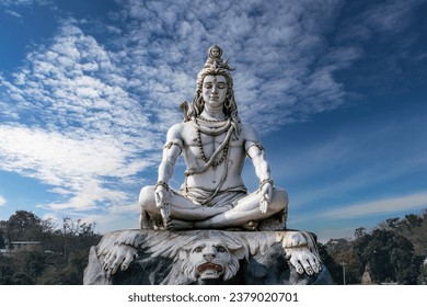 Lord Shiva statue on the banks of the sacred Ganges River in Rishikesh, India. 