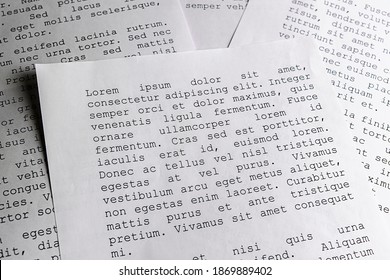 lorem ipsum dolor sit amet concept. selective focus photo of paper sheets with publishing and graphic design placeholder text on them.
