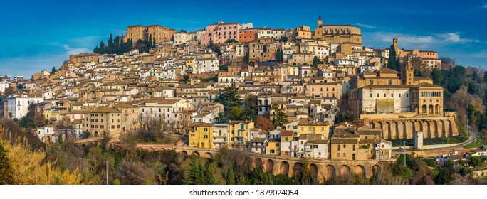 Loreto Abrutino in Abruzzo, Italy. It is a medieval town on to of the hill. Blue sky. Panorama view.