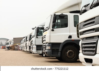 lorries parked up outside a company's car parking area ready to deliver goods to customers no people stock photo
